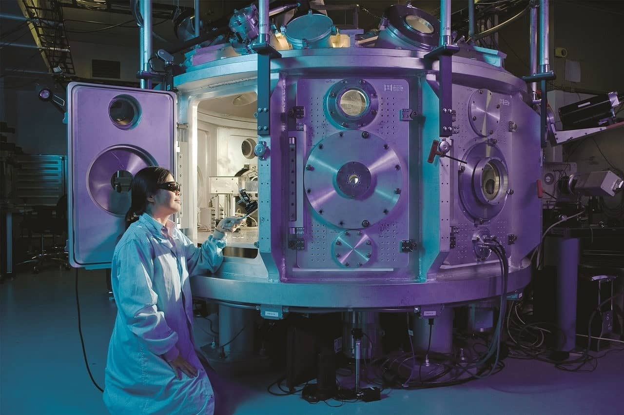 Image of a scientist using a vacuum chamber